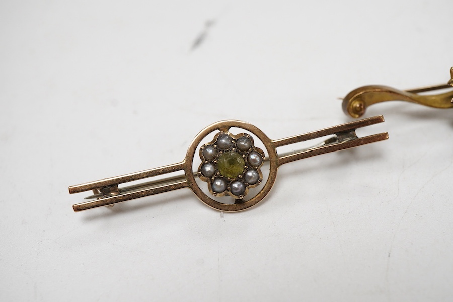 An Edwardian 15ct gold and seed pearl set foliate bar brooch, 41mm, together with a 9ct gold and gem set bar brooch and one other yellow metal and gem set bar brooch.